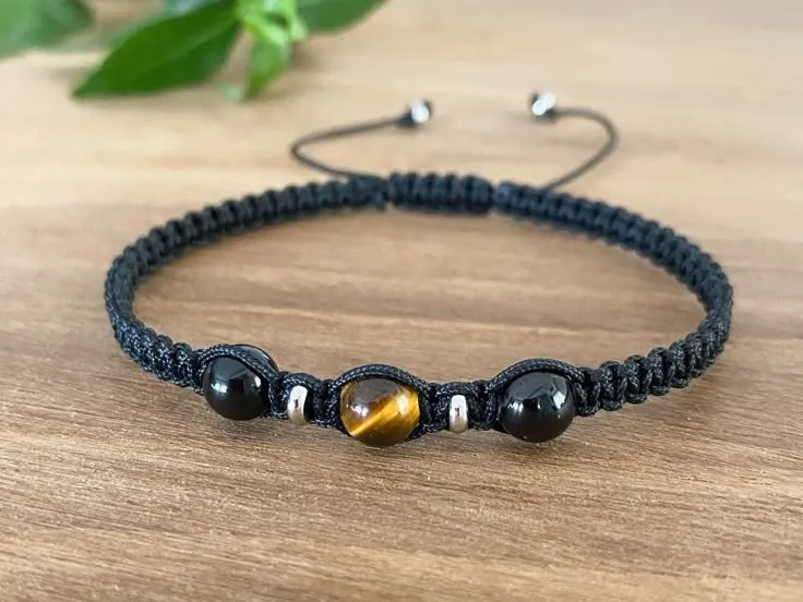Pulsera tejida con detalles en onix y ojo de tigresñ